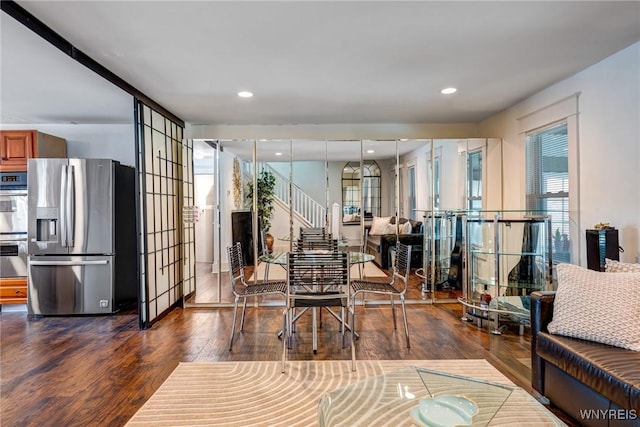 1143 Kensington Ave, Buffalo, NY 14215 - dining space featuring dark wood finished floors, stairway, and recessed lighting