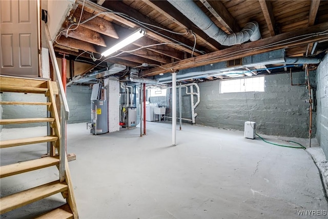 1143 Kensington Ave, Buffalo, NY 14215 - below grade area featuring washer / clothes dryer, gas water heater, stairs, and heating unit