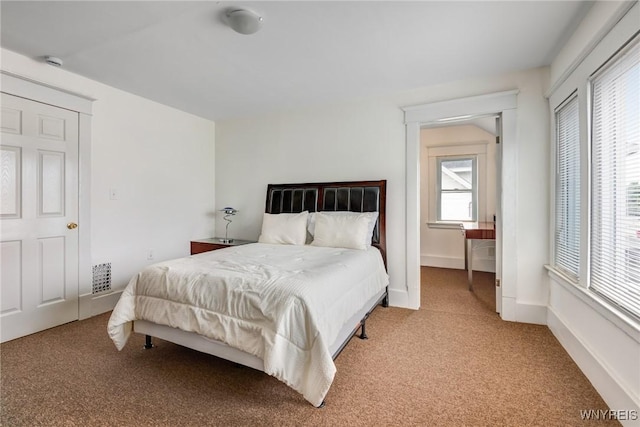 1143 Kensington Ave, Buffalo, NY 14215 - bedroom with light carpet and baseboards