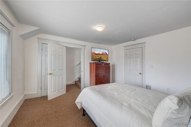 1143 Kensington Ave, Buffalo, NY 14215 - carpeted bedroom featuring multiple windows