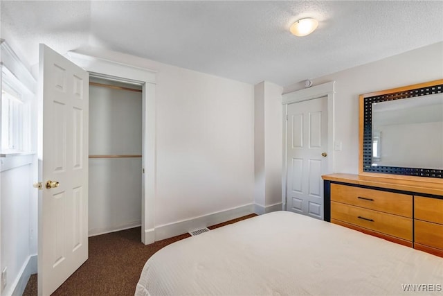 1143 Kensington Ave, Buffalo, NY 14215 - bedroom featuring dark colored carpet and a textured ceiling