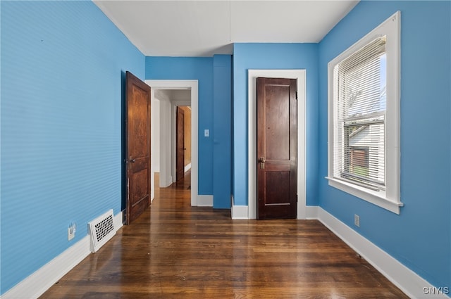 345 Wayland Rd, Salina, NY 13208 - unfurnished bedroom with wood finished floors