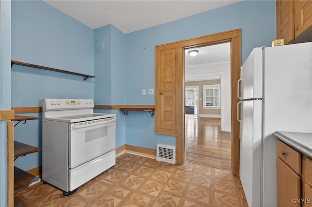 345 Wayland Rd, Salina, NY 13208 - kitchen featuring white appliances and parquet flooring