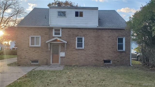 25 Fernwood Ave, West Seneca, NY 14206 - view of front of property with brick siding, a front yard, and a shingled roof
