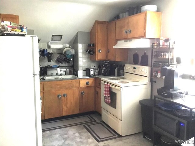 25 Fernwood Ave, West Seneca, NY 14206 - kitchen with white appliances, range hood, brown cabinets, vaulted ceiling, and tasteful backsplash