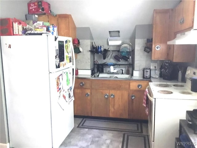 25 Fernwood Ave, West Seneca, NY 14206 - kitchen with white appliances, under cabinet range hood, brown cabinets, tasteful backsplash, and light countertops