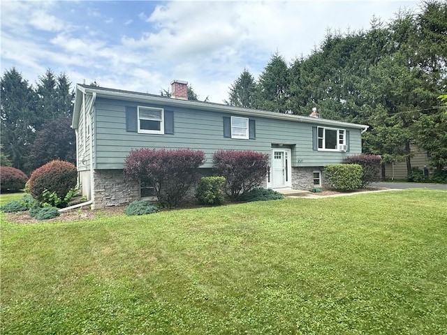 12017 Birch Dr, Corning, NY 14830 - split foyer home featuring a chimney and a front yard