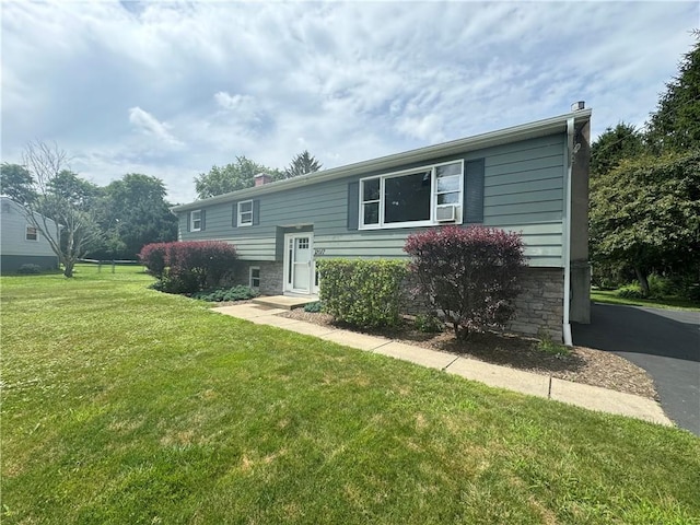 12017 Birch Dr, Corning, NY 14830 - back of house featuring a yard, a chimney, and stone siding
