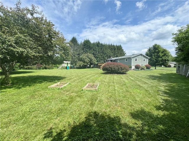 12017 Birch Dr, Corning, NY 14830 - view of grassy yard with a playground