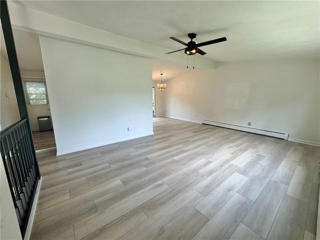 12017 Birch Dr, Corning, NY 14830 - empty room with a baseboard radiator, a chandelier, a ceiling fan, and light wood-style flooring