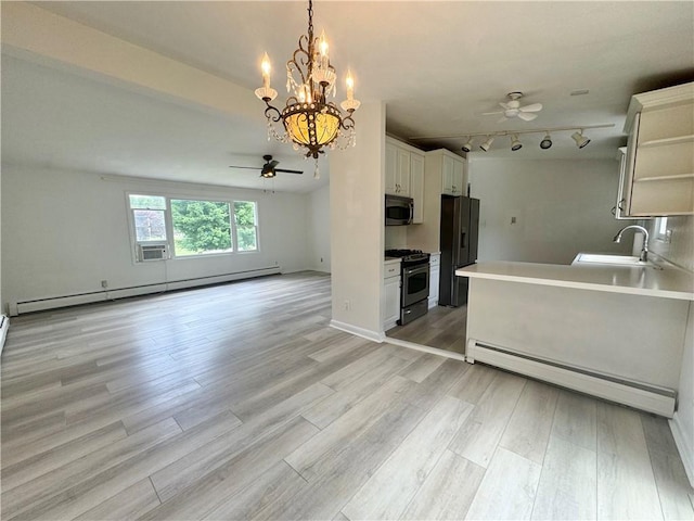 12017 Birch Dr, Corning, NY 14830 - kitchen featuring a ceiling fan, appliances with stainless steel finishes, a baseboard radiator, open floor plan, and a baseboard heating unit