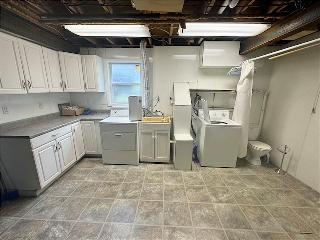 12017 Birch Dr, Corning, NY 14830 - laundry area featuring separate washer and dryer and cabinet space