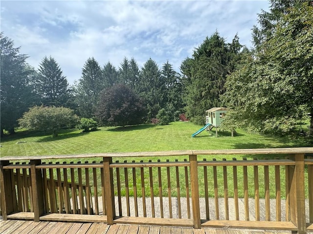 12017 Birch Dr, Corning, NY 14830 - wooden terrace featuring a playground and a yard