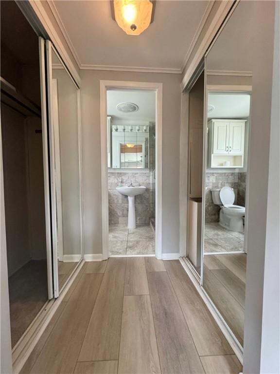 12017 Birch Dr, Corning, NY 14830 - corridor featuring wood finished floors and crown molding