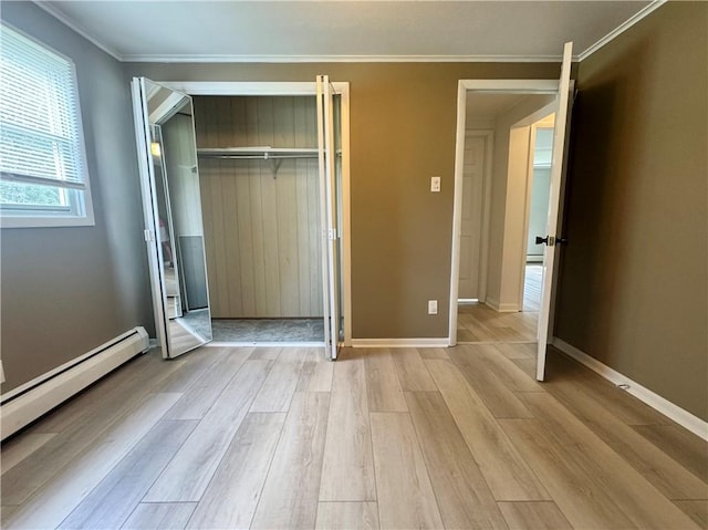 12017 Birch Dr, Corning, NY 14830 - unfurnished bedroom with light wood-type flooring, a closet, ornamental molding, and baseboard heating
