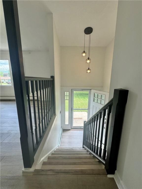 12017 Birch Dr, Corning, NY 14830 - staircase with plenty of natural light and baseboard heating
