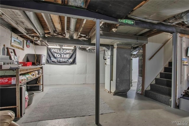 40 Remington Pl, Buffalo, NY 14210 - unfinished basement with heating unit and stairs