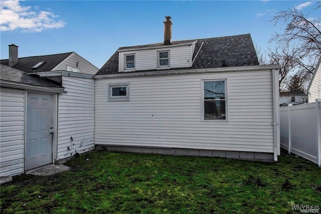 40 Remington Pl, Buffalo, NY 14210 - rear view of property with roof with shingles and a chimney