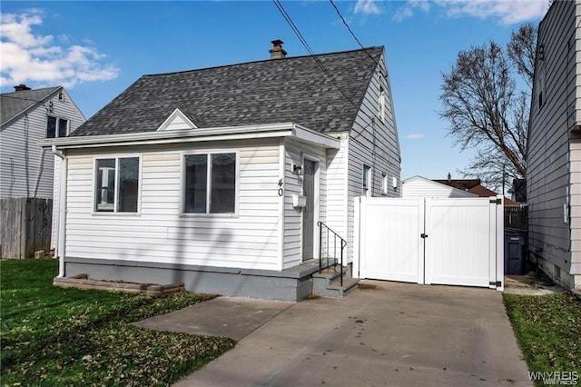 40 Remington Pl, Buffalo, NY 14210 - view of front of house featuring roof with shingles, a gate, a chimney, and entry steps
