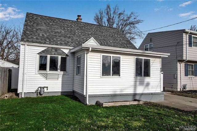 40 Remington Pl, Buffalo, NY 14210 - view of front of home with a chimney and a shingled roof