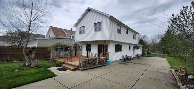 239 Bullis Rd, West Seneca, NY 14224 - back of property with a wooden deck and a patio