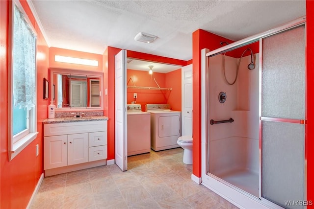 5910 Edgewood Dr, Niagara, NY 14304 - bathroom with vanity, a stall shower, independent washer and dryer, and a textured ceiling