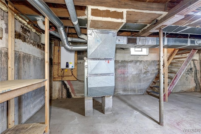 5910 Edgewood Dr, Niagara, NY 14304 - unfinished basement featuring tankless water heater