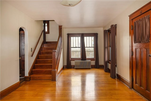 1995 Grand Central Ave, Horseheads, NY 14845 - stairs featuring radiator, plenty of natural light, wood finished floors, and arched walkways