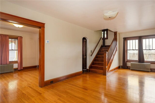 1995 Grand Central Ave, Horseheads, NY 14845 - stairs with radiator, wood finished floors, and arched walkways