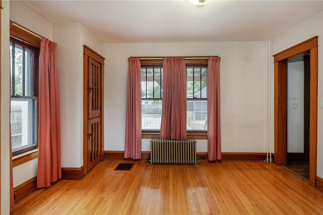 1995 Grand Central Ave, Horseheads, NY 14845 - empty room with radiator heating unit and light wood-style floors
