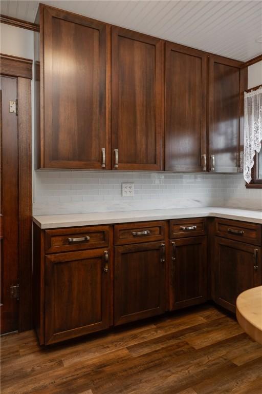 1995 Grand Central Ave, Horseheads, NY 14845 - kitchen with decorative backsplash, light countertops, and dark wood-type flooring