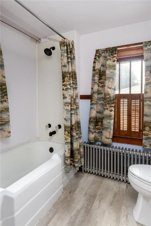1995 Grand Central Ave, Horseheads, NY 14845 - bathroom with radiator heating unit, shower / tub combo, and wood finished floors