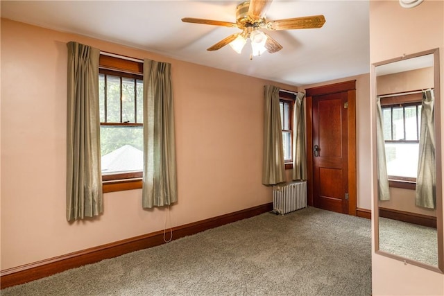 1995 Grand Central Ave, Horseheads, NY 14845 - unfurnished bedroom featuring radiator, carpet flooring, and a ceiling fan
