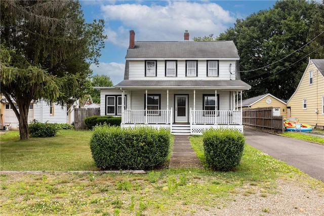 1995 Grand Central Ave, Horseheads, NY 14845 - view of front of house featuring a porch, a chimney, and driveway