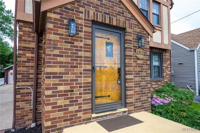 2912 Eggert Rd, Tonawanda, NY 14150 - property entrance with brick siding and a garage