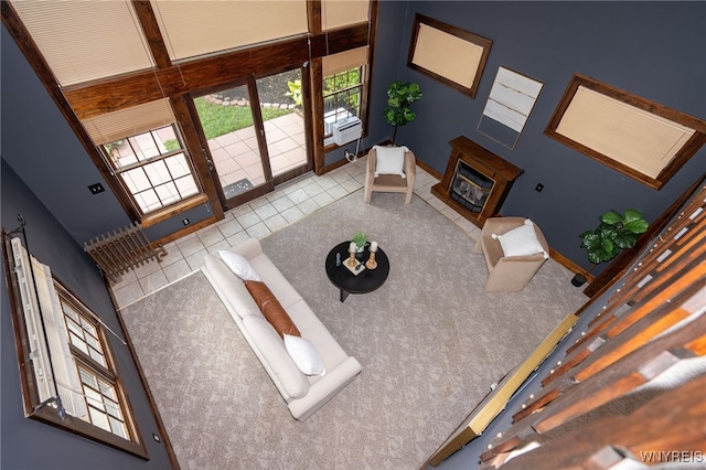 2912 Eggert Rd, Tonawanda, NY 14150 - living area with a glass covered fireplace and tile patterned flooring