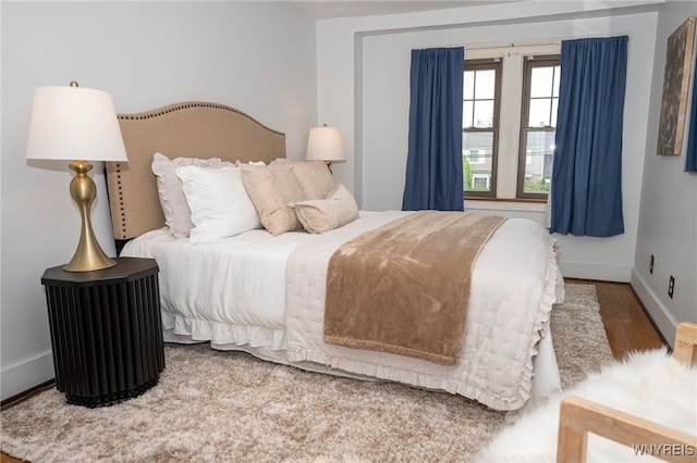 2912 Eggert Rd, Tonawanda, NY 14150 - bedroom featuring wood finished floors and baseboards