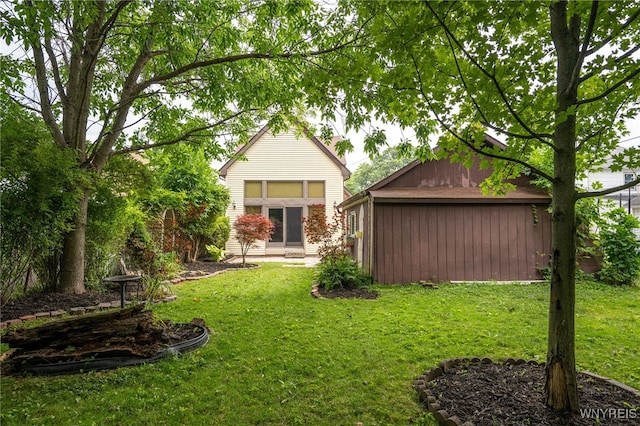 2912 Eggert Rd, Tonawanda, NY 14150 - back of property featuring an outbuilding and a lawn