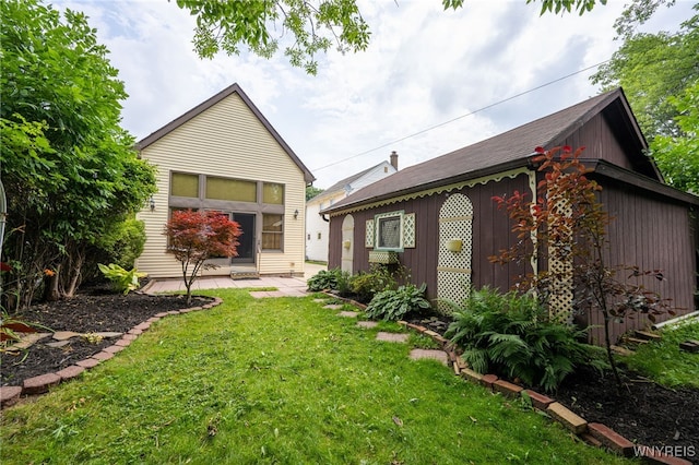 2912 Eggert Rd, Tonawanda, NY 14150 - rear view of house with a yard and a patio