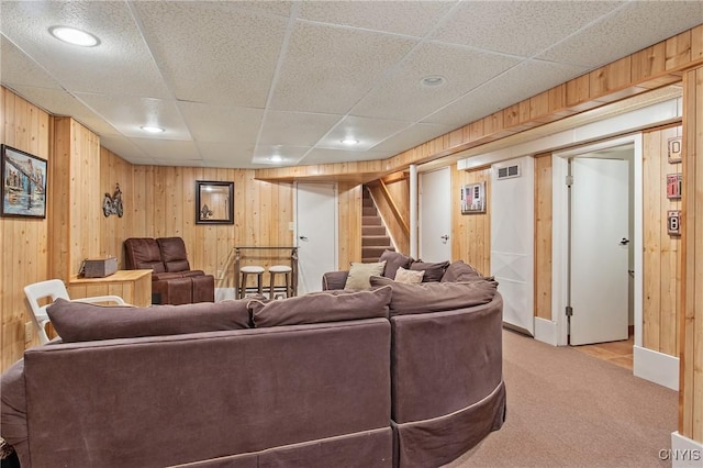 511 Drexler St, Salina, NY 13088 - living area featuring light carpet, wood walls, stairs, a drop ceiling, and recessed lighting