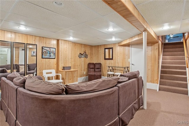 511 Drexler St, Salina, NY 13088 - living area featuring carpet flooring, stairway, wooden walls, a drop ceiling, and recessed lighting