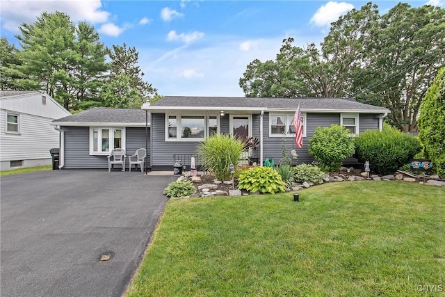 511 Drexler St, Salina, NY 13088 - view of front facade featuring a front lawn, asphalt driveway, and roof with shingles