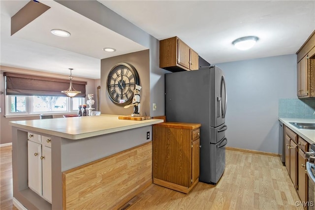 511 Drexler St, Salina, NY 13088 - kitchen featuring stainless steel refrigerator with ice dispenser, light wood-type flooring, light countertops, range, and recessed lighting