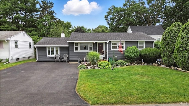 511 Drexler St, Salina, NY 13088 - view of front of property featuring a front lawn, asphalt driveway, a chimney, and a shingled roof