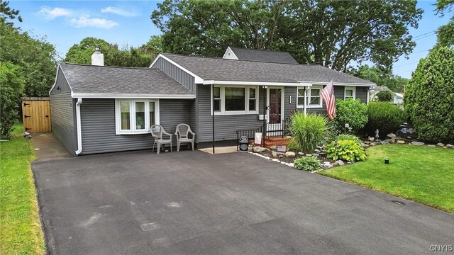 511 Drexler St, Salina, NY 13088 - ranch-style house featuring a front lawn, a shingled roof, and a chimney