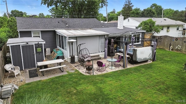 511 Drexler St, Salina, NY 13088 - back of property featuring a fenced backyard, a storage shed, a chimney, a patio area, and a gazebo