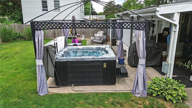 511 Drexler St, Salina, NY 13088 - fenced backyard featuring a hot tub and grilling area