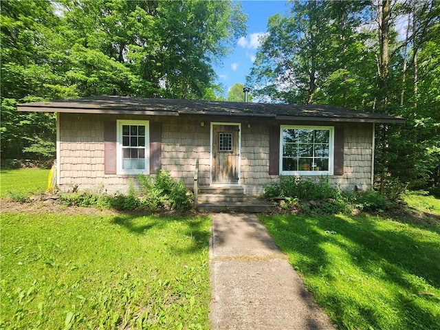 142 John Smith Rd, Pharsalia, NY 13844 - ranch-style house with a front lawn