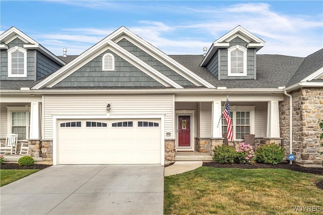 9443 Heritage Path Unit B, Clarence, NY 14032 - craftsman house with a porch, stone siding, a garage, and driveway