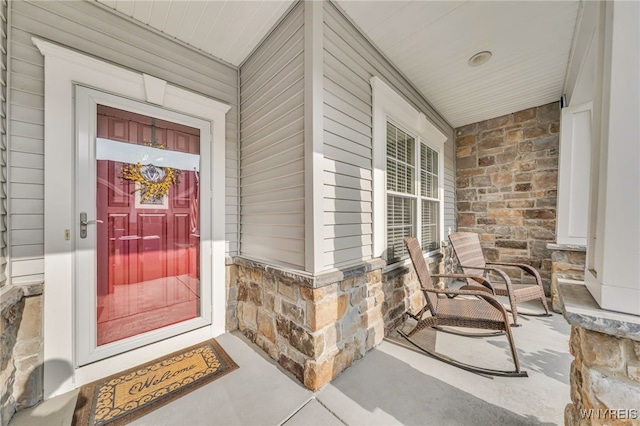 9443 Heritage Path Unit B, Clarence, NY 14032 - entrance to property with covered porch and stone siding